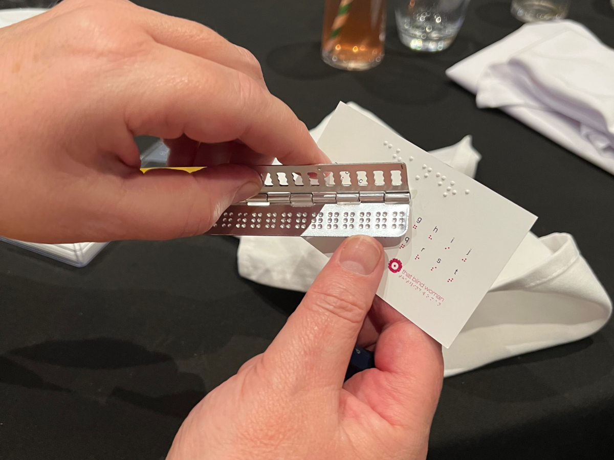 A manual Braille device being demonstrated
