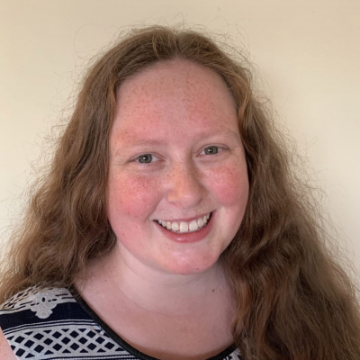 Heidi smiling in a light coloured room