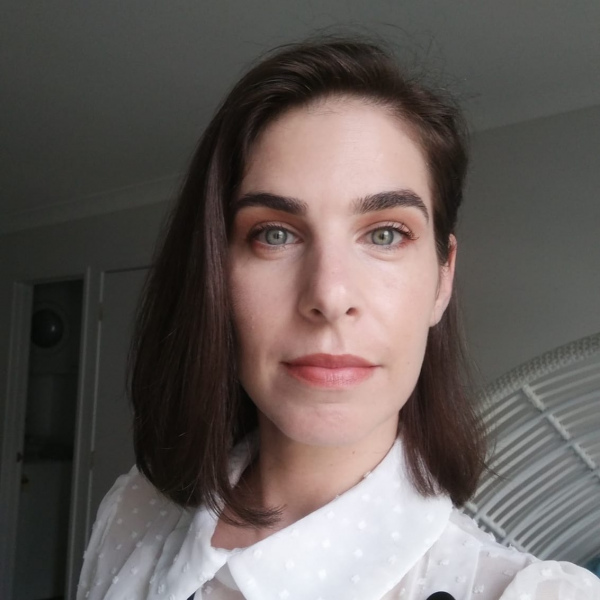 Sandrine looking relaxed in a light coloured room.