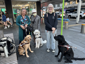 Sally with Sienna, Wendy with Inca, Ivy with Yale standing in front of shop in Auckland.
