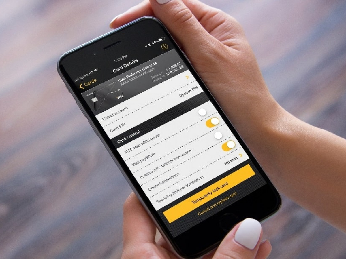 Smart phone screen displaying the ASB app, currently on a credit card screen, showing options for turning features on and off, temporarily pausing transactions on a card, and more.