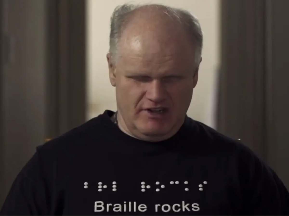 Bruce Maguire wearing a Braille Rocks t-shirt