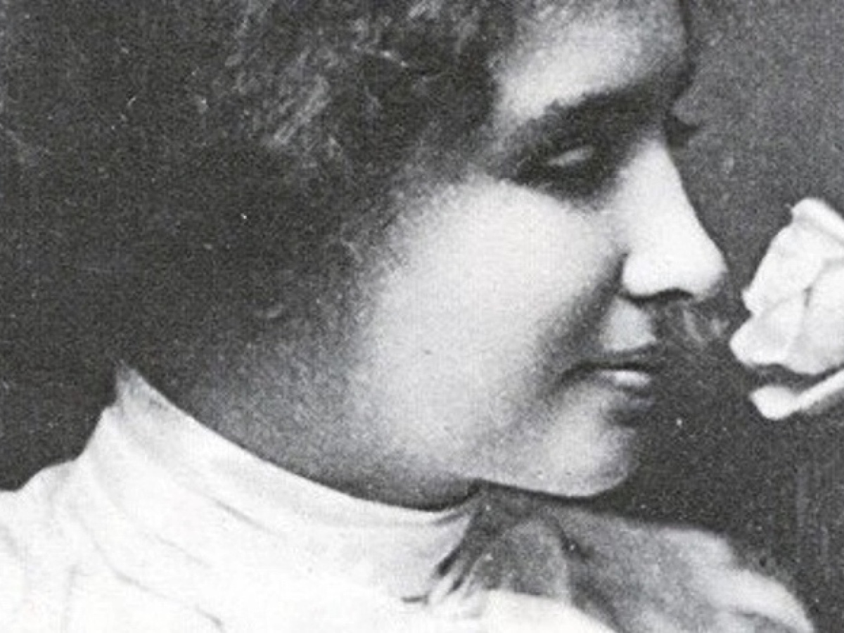Helen Keller smelling a rose