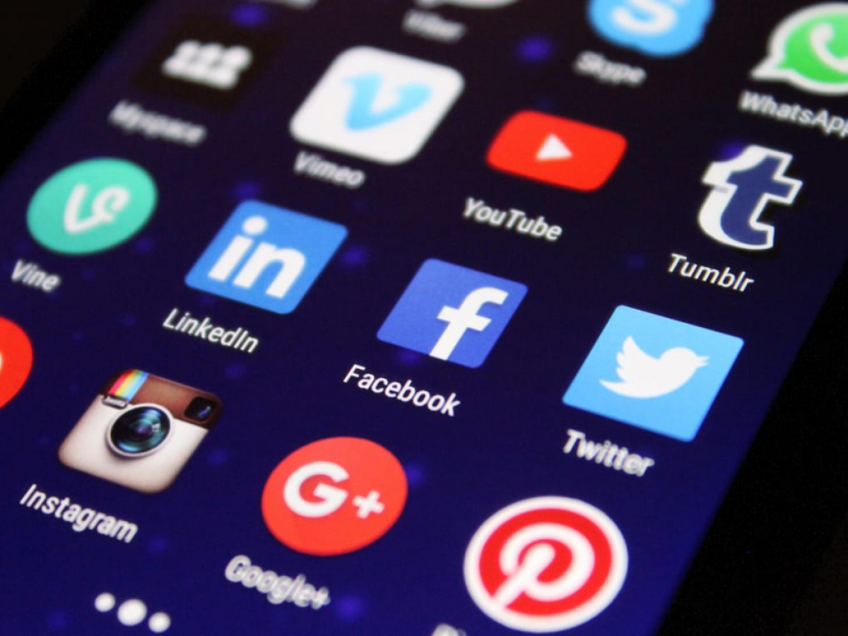 Various social media icons on phone screen