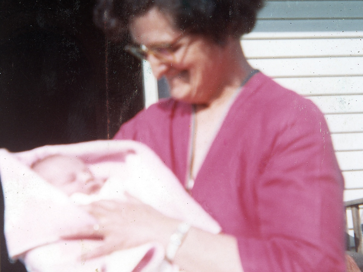 Baby Chandra being cuddled by Granny Esther